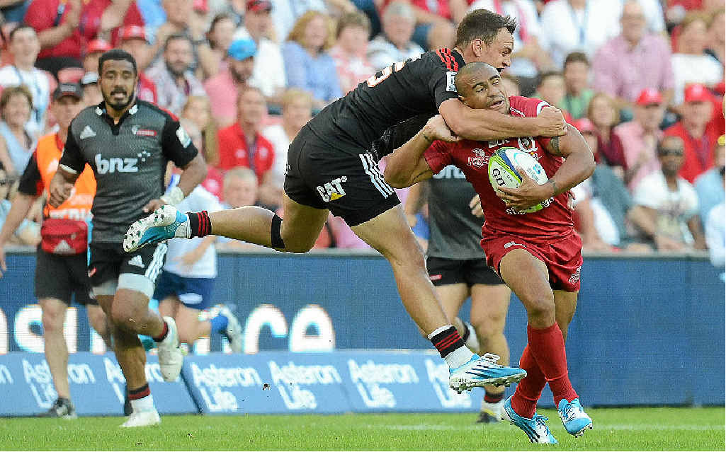 HALF MEASURE: Crusaders fullback Israel Dagg goes high on Reds halfback Will Genia during yesterday’s match at Suncorp Stadium. HALF MEASURE: Crusaders fullback Israel Dagg goes high on Reds halfback Will Genia during yesterday’s match at Suncorp Stadium.